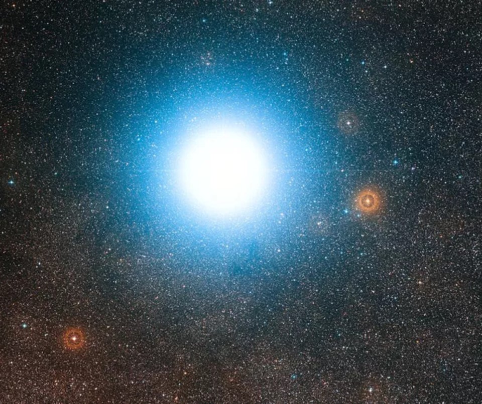 This wide-field view of the sky around the bright star system Alpha Centauri was created from photographic images forming part of the Digitized Sky Survey 2.