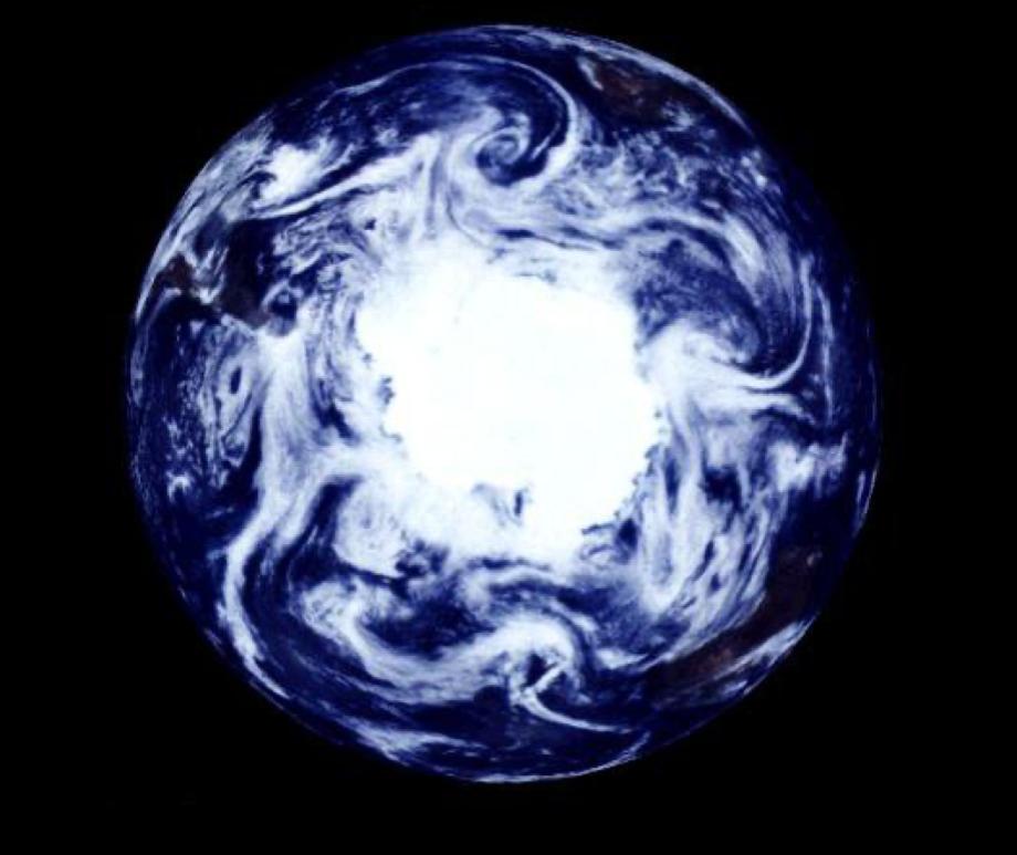 True-color satellite image of Earth centred on the South Pole with cloud coverage.