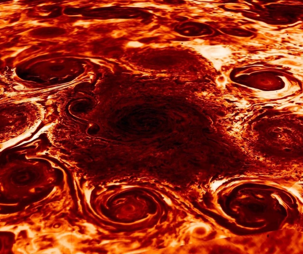 This image from the Juno spacecraft shows the nine cyclones at Jupiter’s north pole in infrared