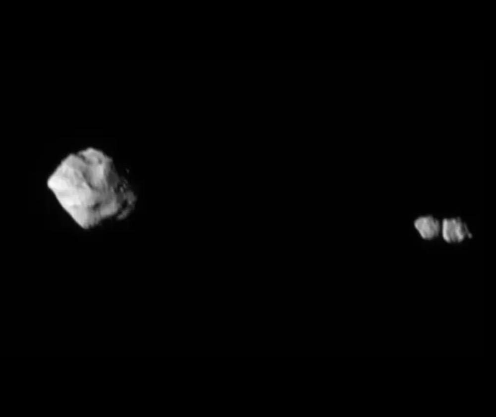 Asteroid Dinky on the left and its little moon, Selam, on the right