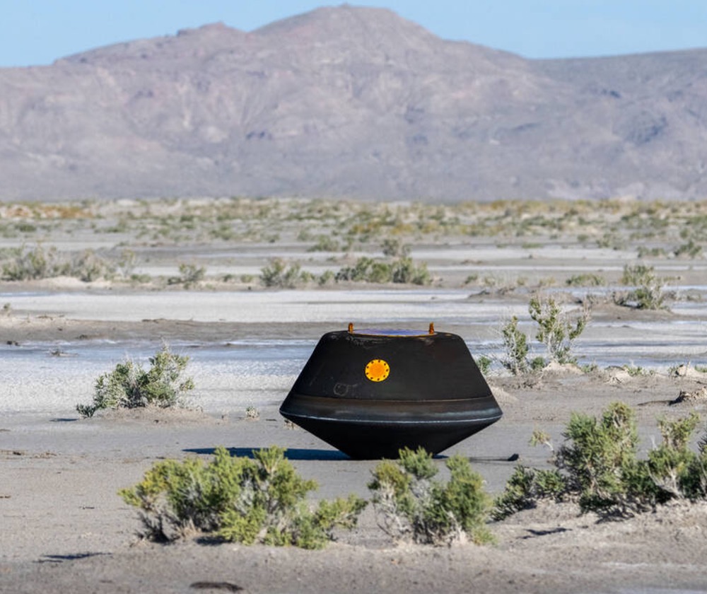 The sample return capsule from NASA’s OSIRIS-REx mission is seen shortly after touching down in the desert, Sunday, Sept. 24, 2023