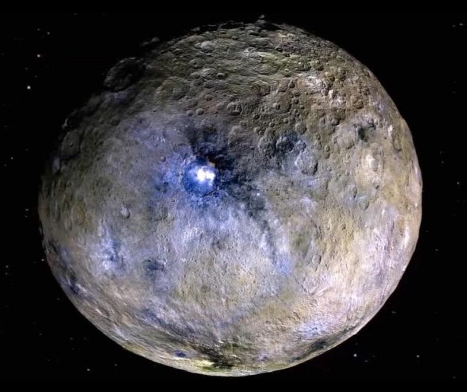 Here’s a view of dwarf planet Ceres in false color. This view makes it easy to see the bright spots on Ceres’ surface.