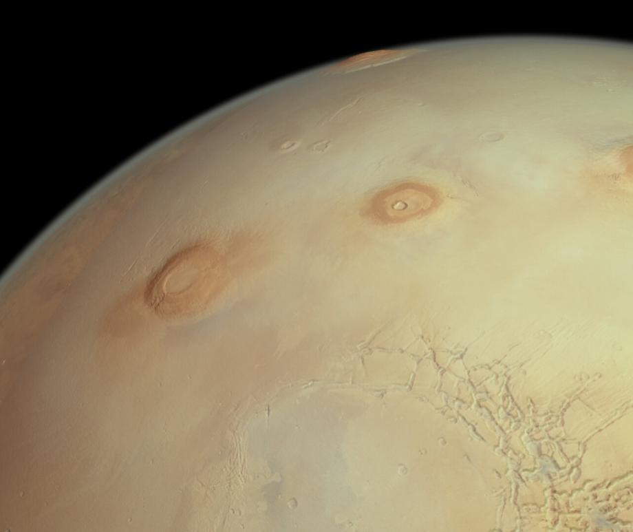 This perspective view from ESA’s Mars Express shows three of Mars’ famously colossal volcanoes (from left to right): Arsia, Pavonis and Ascraeus Mons. Image credit: ESA / DLR / FU Berlin.