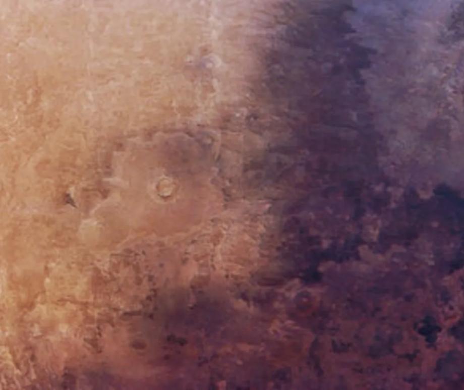 A section of Mars' Utopia Planitia covered with dark volcanic materials is slowly expanding across the Red Planet's surface.