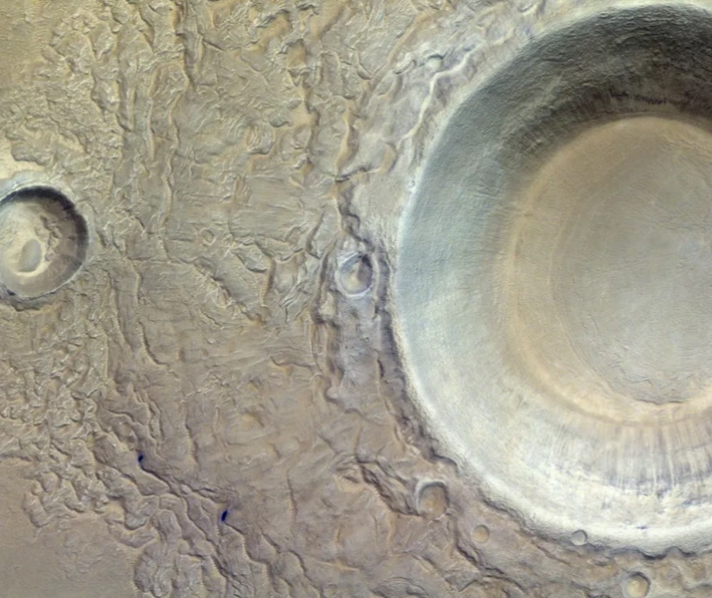 A panoramic view of Mars’ Utopia Planitia region with a massive impact crater as seen by the ExoMars Trace Gas Orbiter (TGO)