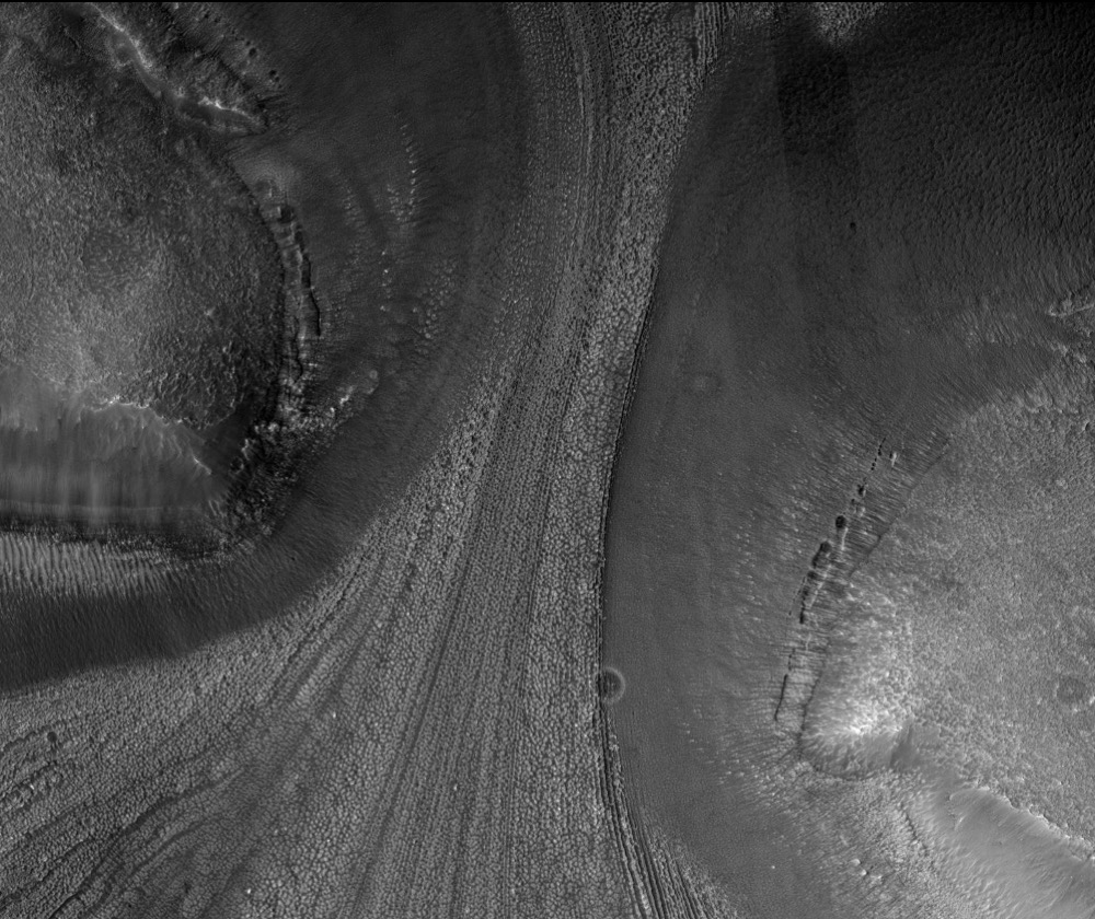 HiRISE image showing rough terrain possibly shaped by ancient glaciers