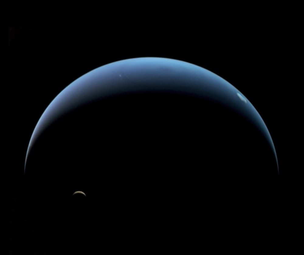 A view of Triton and Neptune taken by Voyager 2. The Trident mission could have observed Triton both in sunlight and bathed in “Neptuneshine”