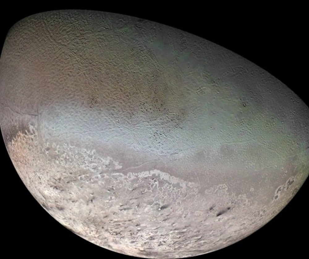 The surface of Neptune’s moon Triton is young and ice covered, with evidence for volcanic plains, as well as mounds and round pits built by icy lava flows