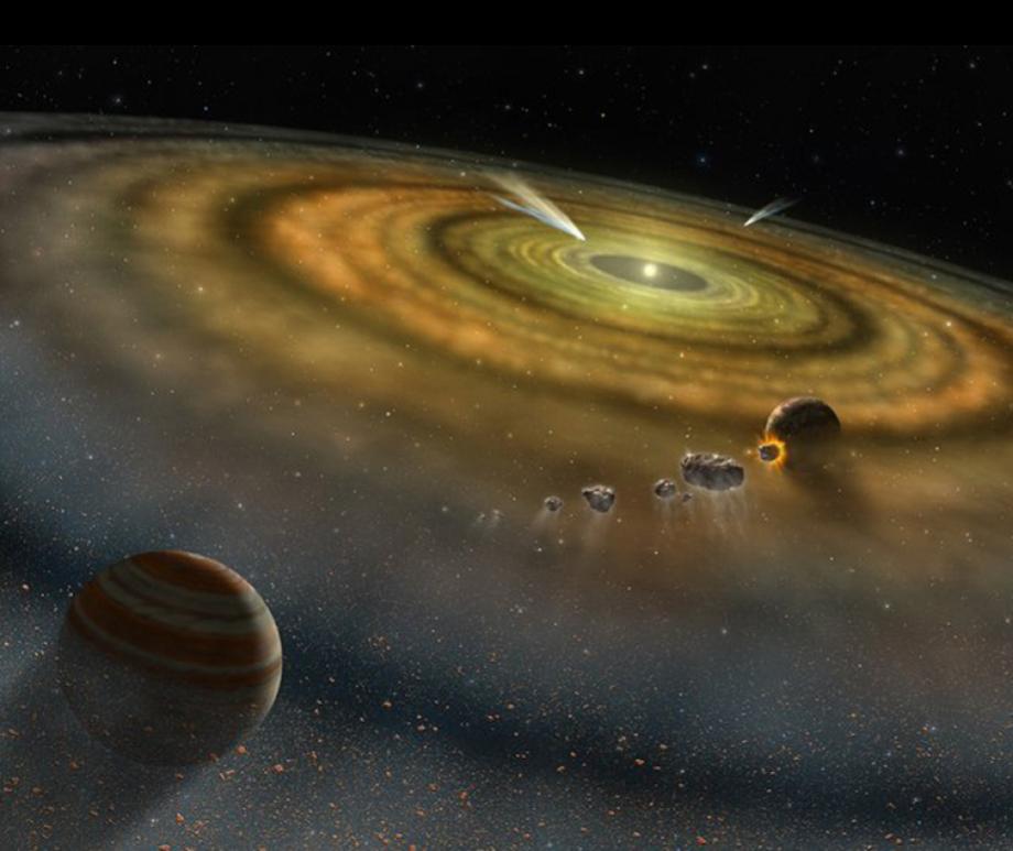 Caption:Artist's conception of the dust and gas surrounding a newly formed planetary system