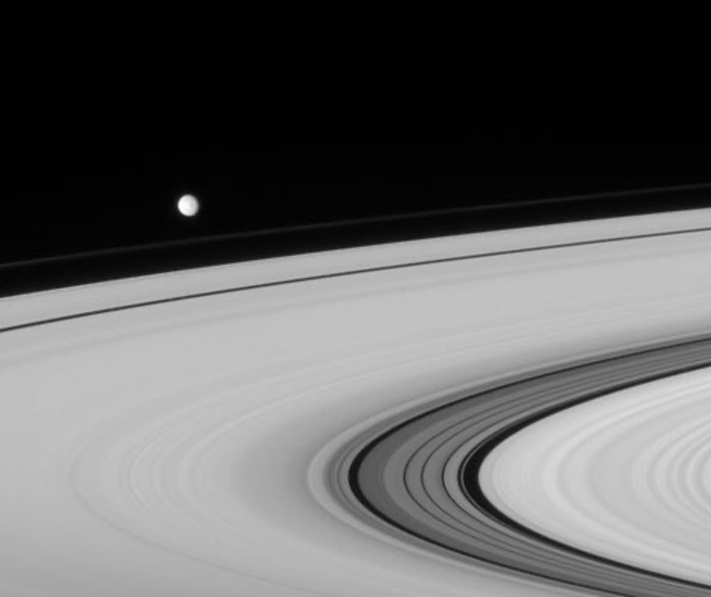 Having recently rounded the ansa, or outer edge of the rings, Mimas heads off toward right