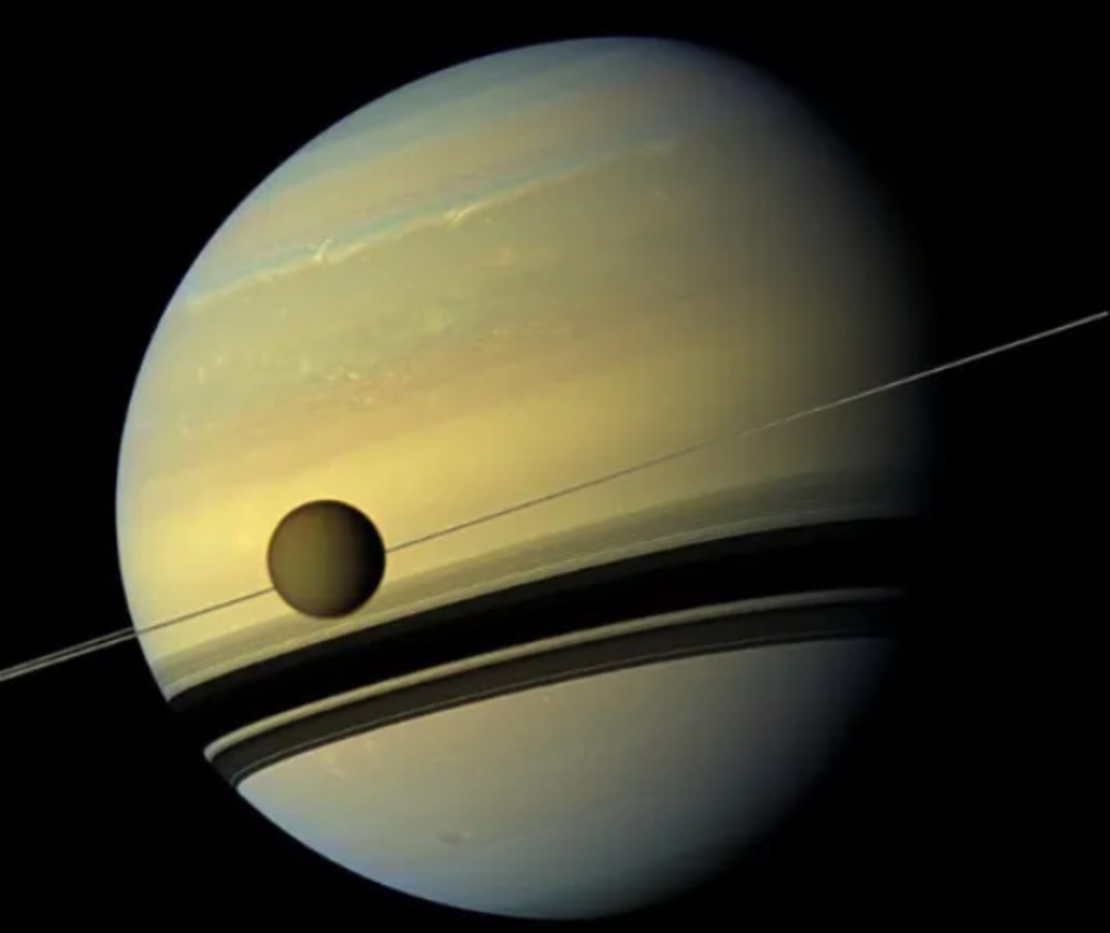 A view of Titan around Saturn taken by Cassini