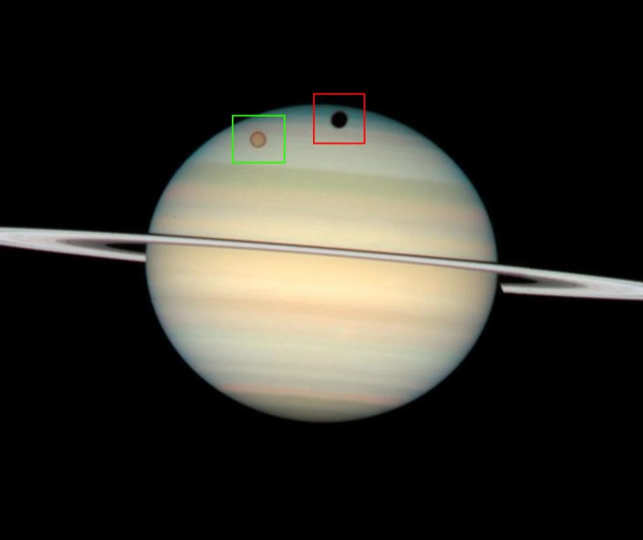 Every 15 years, people on Earth can see the shadow (red box) of Saturn's largest moon Titan (green box) move across the ringed planet.