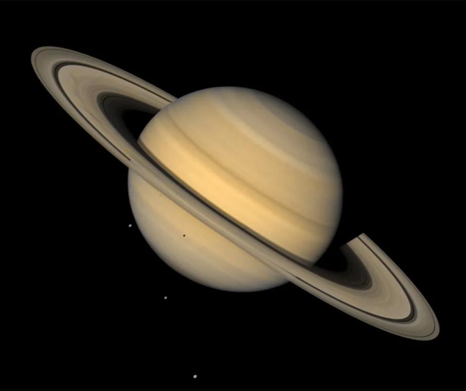 Saturn is known for its stunning rings and its many moons (four seen here), but they aren’t the planet’s only companions. Its first known Trojan — an asteroid that shares the planet’s orbit around the sun — has now been discovered.