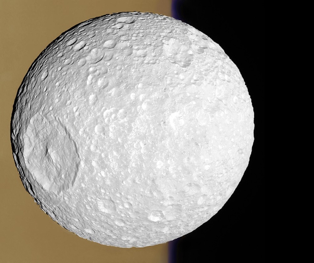 Mimas in front of Saturn imaged by Cassini