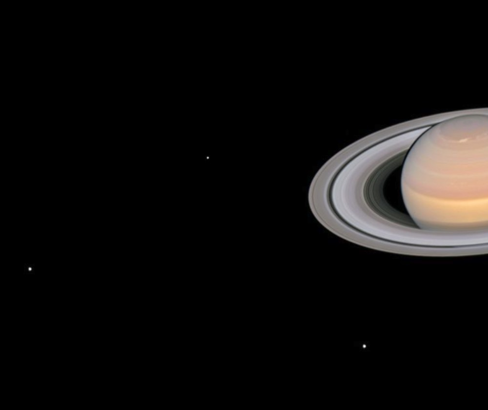 This Hubble Space Telescope image of Saturn, captured in June 2018, shows six of the planet’s 145 known moons