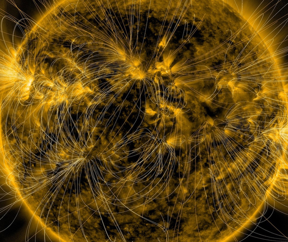 This illustration lays a depiction of the sun's magnetic fields over an image captured by NASA’s Solar Dynamics Observatory on March 12, 2016