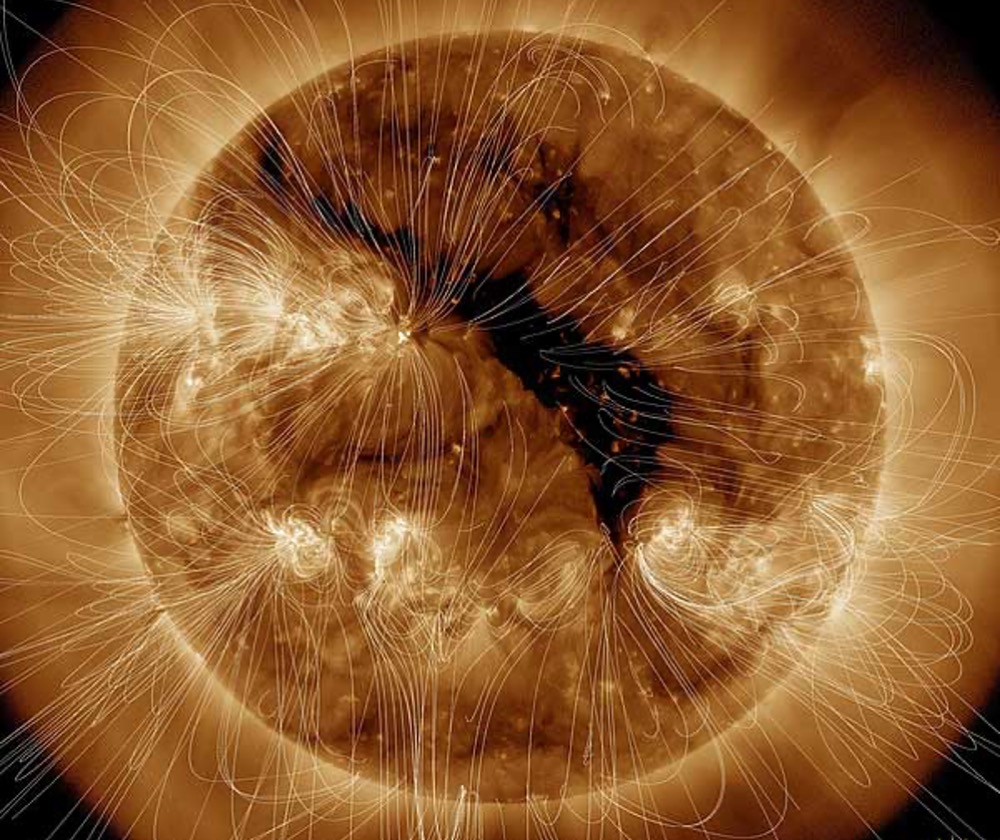 Over a coronal hole (here, the dark region near the center of the image) are open to interplanetary space, allowing accelerated to flow fast and furious, at speeds up to 800 km/s (2 million mph)