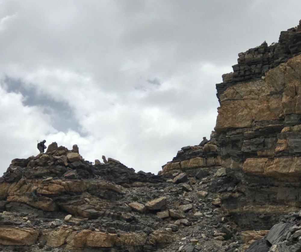 A geologist collects magma samples in a field campaign over the Tibetan Plateau